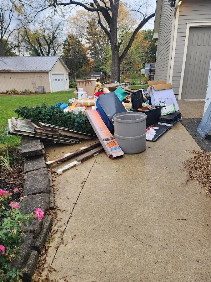 Dumpster being loaded with debris for Roofing Dumpster Rental in Northchase
